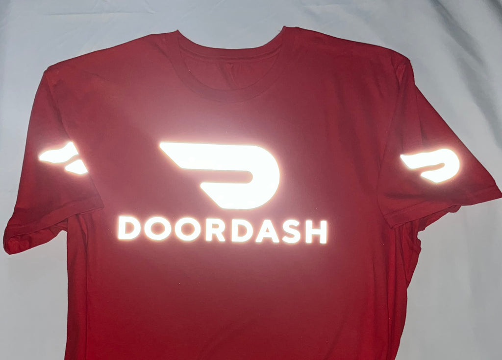 Reflective Red t-shirt with DoorDash logo and reflective elements on a white background